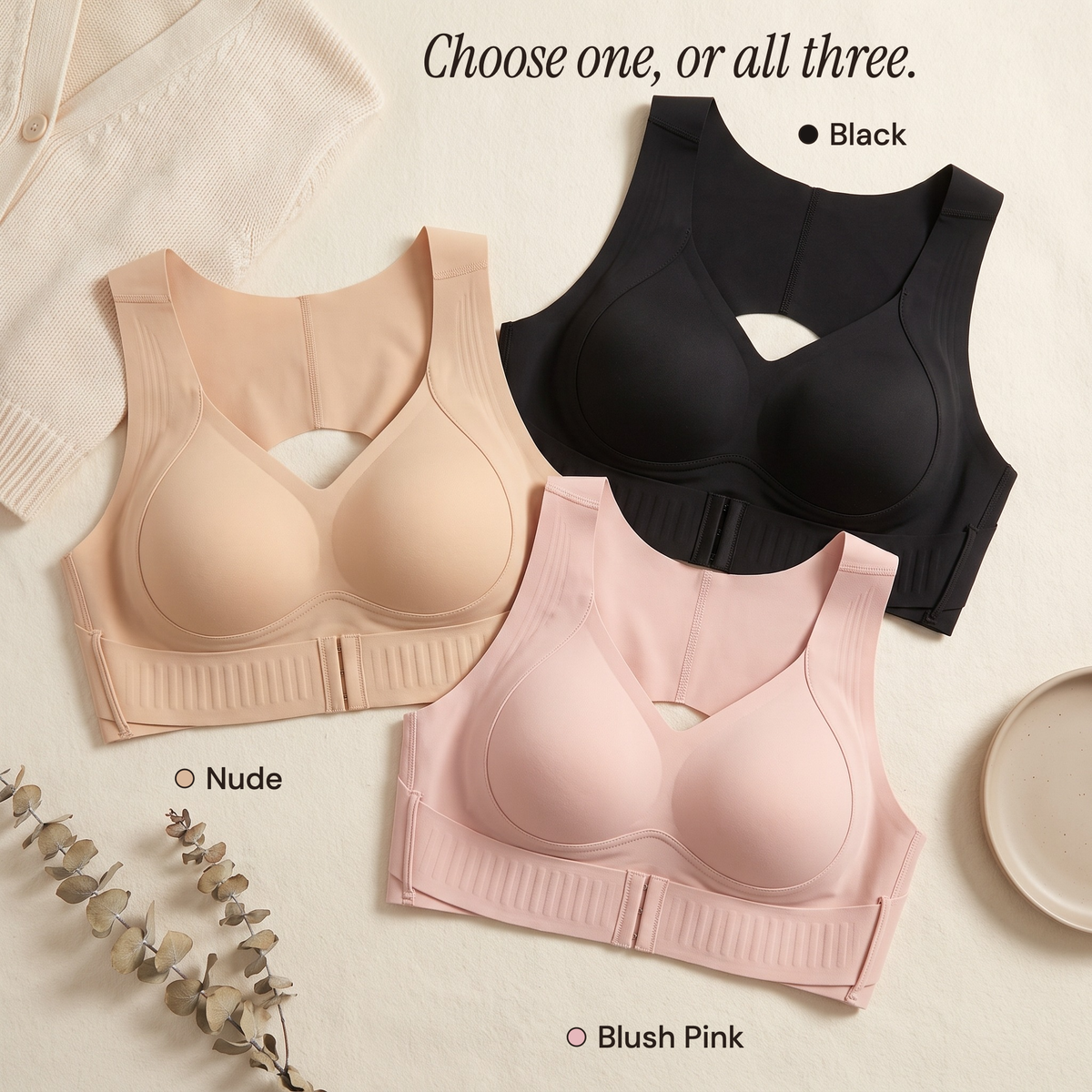 Nude, black and blush pink bras laid flat